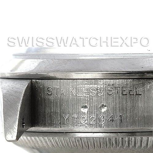 The image shows a detailed view of the case side of a Rolex Datejust 79240 Women's Stainless Steel Blue Dial 79240 Women's Stainless Steel Blue Dial watch, highlighting the serial number and "STAINLESS STEEL" engraving.