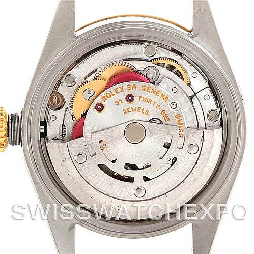 This image shows the movement mechanism of a Rolex Datejust 79163 Women's Steel and Gold (two tone) Mother of Pearl Dial 79163 Women's Steel and Gold (two tone) Mother of Pearl Dial model, viewed from the back with the case open.