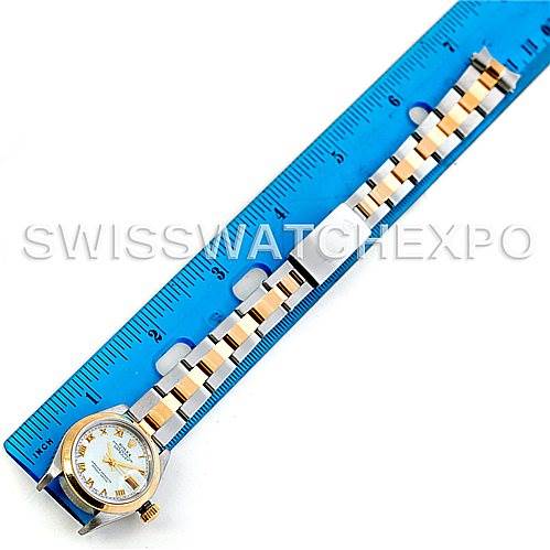 This image shows a Rolex Datejust 79163 Women's Steel and Gold (two tone) Mother of Pearl Dial 79163 Women's Steel and Gold (two tone) Mother of Pearl Dial watch with a ruler, displaying the entire watch including the face and bracelet from a top-down angle.