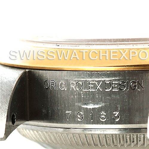 The image shows a close-up of the side of a Rolex Datejust 79163 Women's Steel and Gold (two tone) Mother of Pearl Dial 79163 Women's Steel and Gold (two tone) Mother of Pearl Dial watch with part of the bezel and the model number 79163 engraved on the case.