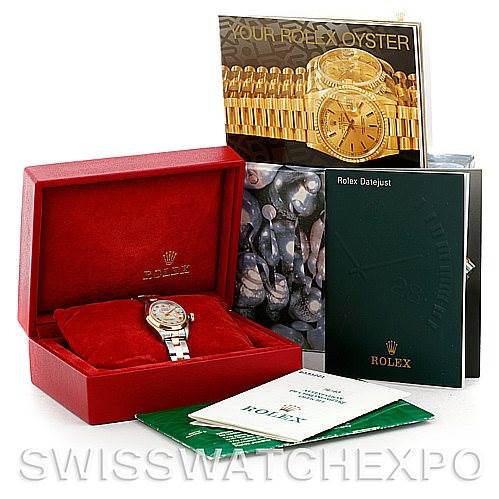 The image shows a Rolex Datejust 79163 Women's Steel and Gold (two tone) Mother of Pearl Dial 79163 Women's Steel and Gold (two tone) Mother of Pearl Dial watch in its box, accompanied by manuals and booklets displayed around it.