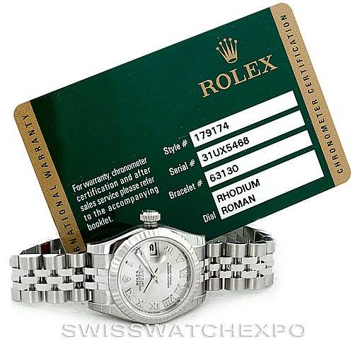 The image displays a Rolex Datejust 179174 Women's Stainless Steel Grey Dial 179174 Women's Stainless Steel Grey Dial watch with a jubilee bracelet and warranty card, viewed from the front and slightly above.