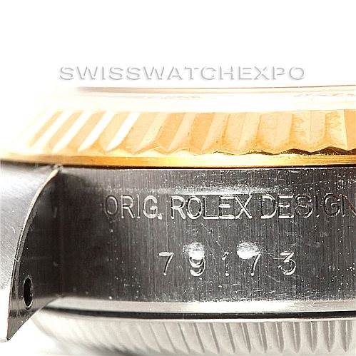 This image shows a close-up side view of the case of a Rolex Datejust 79173 Women's Stainless Steel Mother of Pearl Dial 79173 Women's Stainless Steel Mother of Pearl Dial watch, highlighting the model number and fluted bezel.