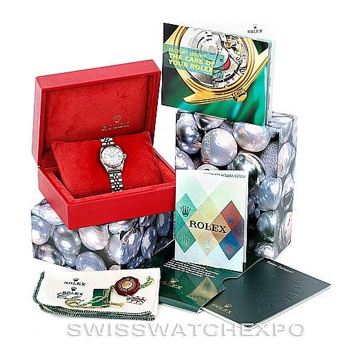 The image shows a Rolex Datejust 79174 Women's Stainless Steel Silver Dial 79174 Women's Stainless Steel Silver Dial watch in its box, along with various manuals and accessories arranged around it.