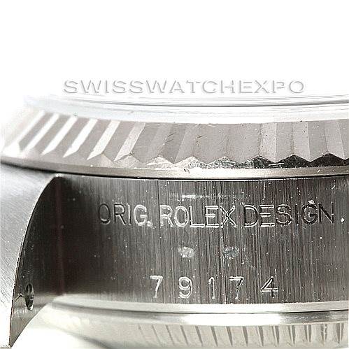 This is a close-up view of the side of a Rolex Datejust 79174 Women's Stainless Steel Silver Dial 79174 Women's Stainless Steel Silver Dial watch, showing the case with its engraved model number "79174".