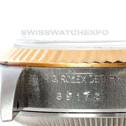 The image shows a close-up of the case side and bezel of a Rolex Datejust 69173 Women's Stainless Steel White Dial 69173 Women's Stainless Steel White Dial, highlighting the "ORIG. ROLEX DESIGN" engraving and reference number.