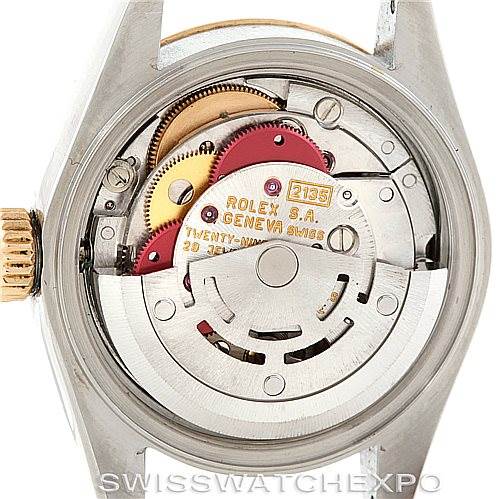 The image shows the movement mechanism of a Rolex Datejust 69173 Women's Stainless Steel White Dial 69173 Women's Stainless Steel White Dial watch from a rear perspective, highlighting intricate gears and components.