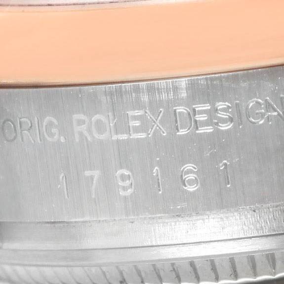 This close-up image shows the engraved bezel of a Rolex Datejust 179161 Women's Steel and Gold (two tone) Black Dial 179161 Women's Steel and Gold (two tone) Black Dial watch.