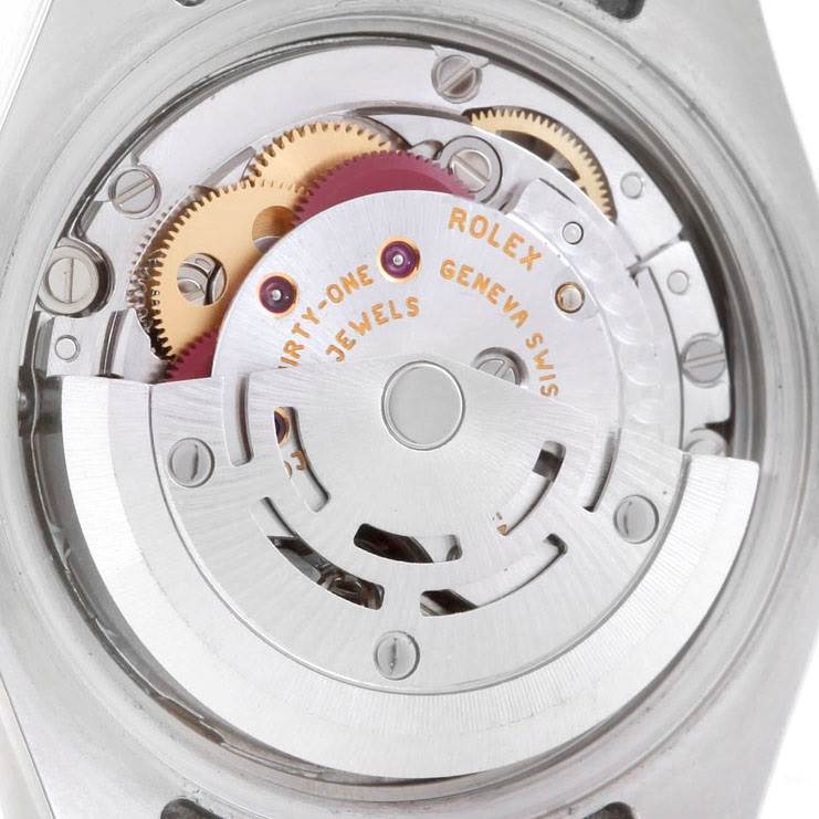 The image shows a close-up of the movement and internal mechanisms of a Rolex Datejust 179161 Women's Steel and Gold (two tone) Black Dial 179161 Women's Steel and Gold (two tone) Black Dial watch.