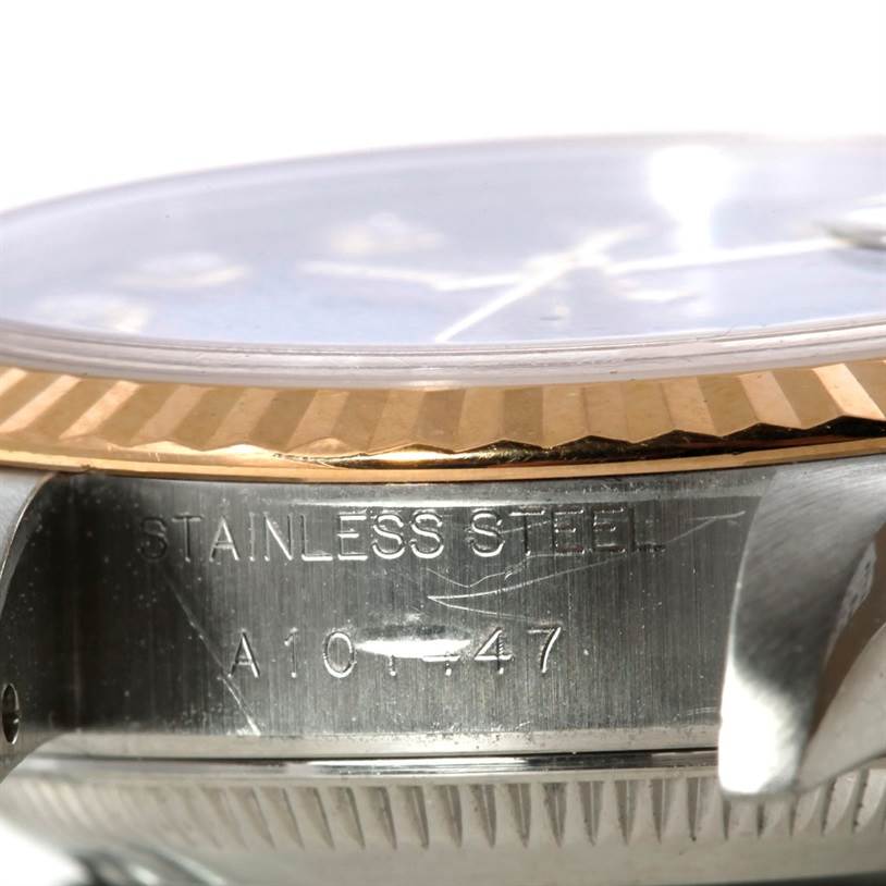 This close-up image shows the side of the case and bezel of a Rolex Datejust 79163 Women's Steel and Gold (two tone) Black Dial 79163 Women's Steel and Gold (two tone) Black Dial, highlighting the "Stainless Steel" marking.