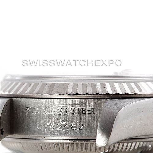 The image shows a close-up side view of the bezel, crown guard, and serial number engraving on a Rolex Datejust 69174 Women's Stainless Steel Pink Dial 69174 Women's Stainless Steel Pink Dial watch.