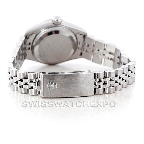 The image shows the back of a Rolex Datejust 69174 Women's Stainless Steel Pink Dial 69174 Women's Stainless Steel Pink Dial watch and its folded, stainless steel Jubilee bracelet clasp.