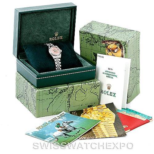 The image shows a Rolex Datejust 69174 Women's Stainless Steel Pink Dial 69174 Women's Stainless Steel Pink Dial watch in its original box, surrounded by its packaging, manuals, and booklets.