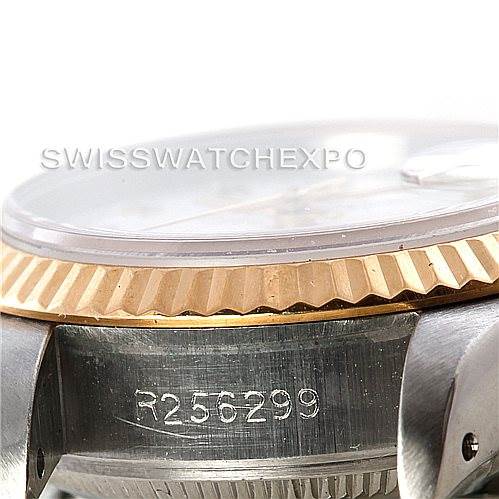 The image shows a close-up angle of the serial number and bezel of a Rolex Datejust 69163 Women
s Stainless Steel White Dial 69163 Women
s Stainless Steel White Dial model watch.