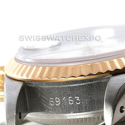 This image shows a close-up side view of a Rolex Datejust 69163 Women
s Stainless Steel White Dial 69163 Women
s Stainless Steel White Dial model, focusing on the bezel, part of the case, and the model number 69163.