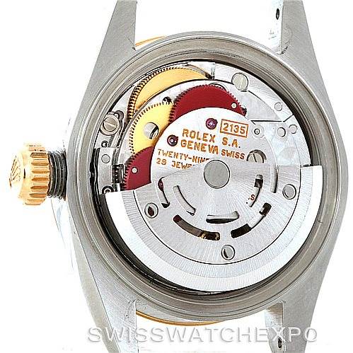 The image shows the rear view of the mechanism of a Rolex Datejust 69173 Women
s Stainless Steel Beige Dial 69173 Women
s Stainless Steel Beige Dial watch, highlighting the intricate internal components.