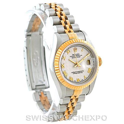 This image shows a Rolex Datejust 69173 Women
s Stainless Steel Beige Dial 69173 Women
s Stainless Steel Beige Dial watch, angled to display the face, gold fluted bezel, and two-tone bracelet in silver and gold.