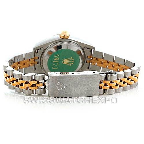 The image shows the back view of a Rolex Datejust 69173 Women
s Stainless Steel Beige Dial 69173 Women
s Stainless Steel Beige Dial model, focusing on the clasp and bracelet with two-tone metal links.