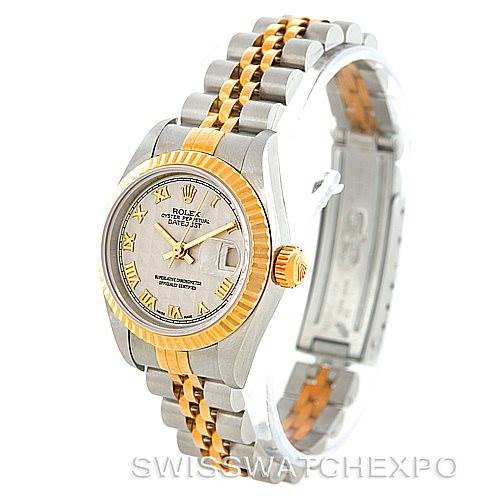 This Rolex Datejust 69173 Women
s Stainless Steel Beige Dial 69173 Women
s Stainless Steel Beige Dial watch is shown from an angled top-down view, highlighting its face, bezel, crown, and two-tone bracelet.