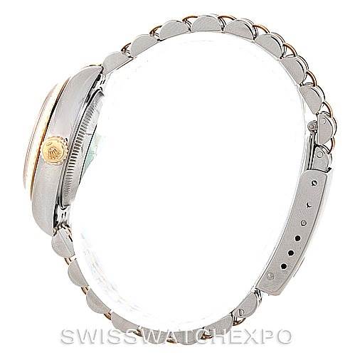 This image shows a Rolex Datejust 69173 Women
s Stainless Steel Beige Dial 69173 Women
s Stainless Steel Beige Dial watch from a side view, displaying the bracelet, crown, and case.