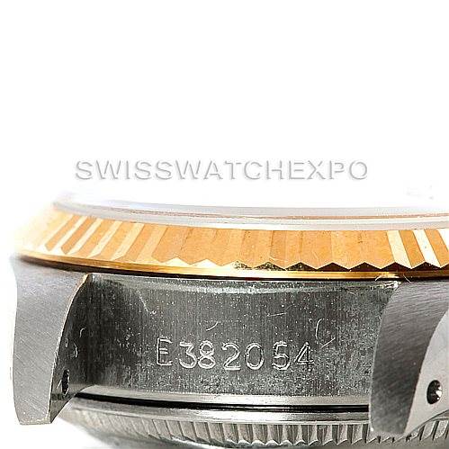 The image shows a close-up of the side of a Rolex Datejust 69173 Women's Stainless Steel White Dial 69173 Women's Stainless Steel White Dial watch case, focusing on the serial number and the fluted bezel.