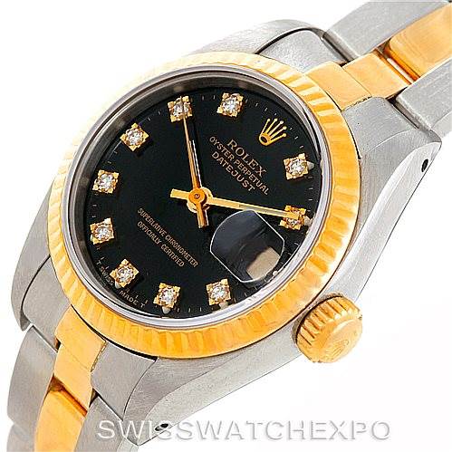 The image shows a close-up angle of a Rolex Datejust 69173 Women's Stainless Steel Black Dial 69173 Women's Stainless Steel Black Dial watch, highlighting its black dial, diamond hour markers, and two-tone band.