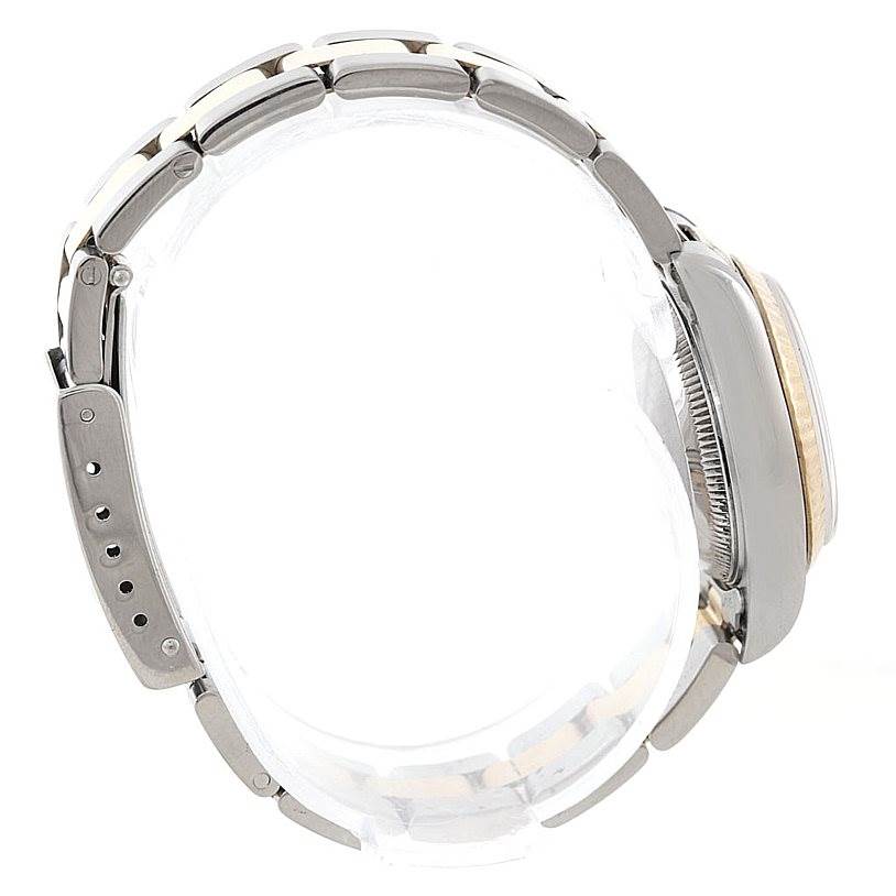 This side view of the Rolex Datejust 69173 Women's Stainless Steel White Dial 69173 Women's Stainless Steel White Dial watch highlights the bracelet and clasp.