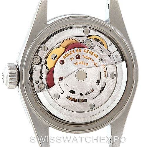 The image shows the back view of a Rolex Datejust 79160 Women's Stainless Steel Silver Dial 79160 Women's Stainless Steel Silver Dial watch, highlighting its internal mechanical movement and parts.