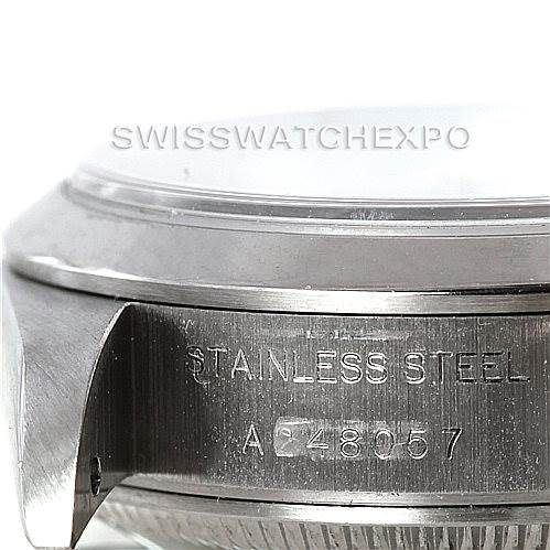 The image shows a close-up of the side of the Rolex Datejust 79160 Women's Stainless Steel Silver Dial 79160 Women's Stainless Steel Silver Dial watch case, highlighting the stainless steel material and serial number.