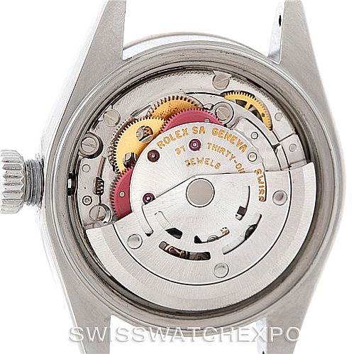 The image shows the internal movement of a Rolex Datejust 79174 Women's Stainless Steel Black Dial 79174 Women's Stainless Steel Black Dial watch, focusing on the gears and rotor.