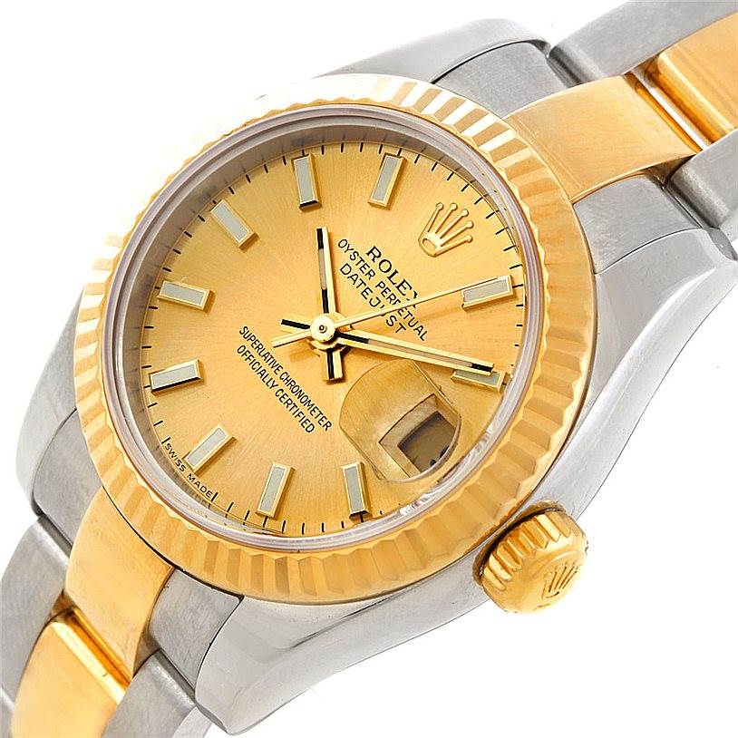 This image shows a close-up, angled view of a Rolex Datejust 179173 Women's Steel and Gold (two tone) Champagne Dial 179173 Women's Steel and Gold (two tone) Champagne Dial watch, highlighting the dial, bezel, crown, and part of the bracelet.