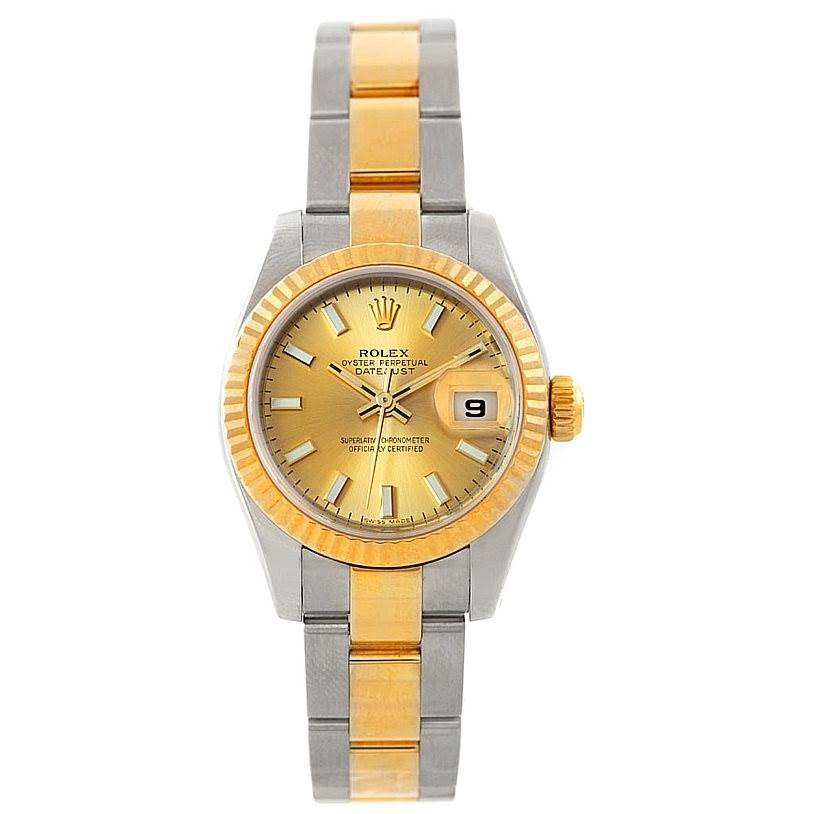 The image shows a front view of a Rolex Datejust 179173 Women's Steel and Gold (two tone) Champagne Dial 179173 Women's Steel and Gold (two tone) Champagne Dial watch with a gold and silver bracelet and a gold dial.