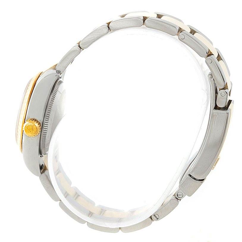 This image shows a side view of the Rolex Datejust 179173 Women's Steel and Gold (two tone) Champagne Dial 179173 Women's Steel and Gold (two tone) Champagne Dial watch focusing on its crown and bracelet.