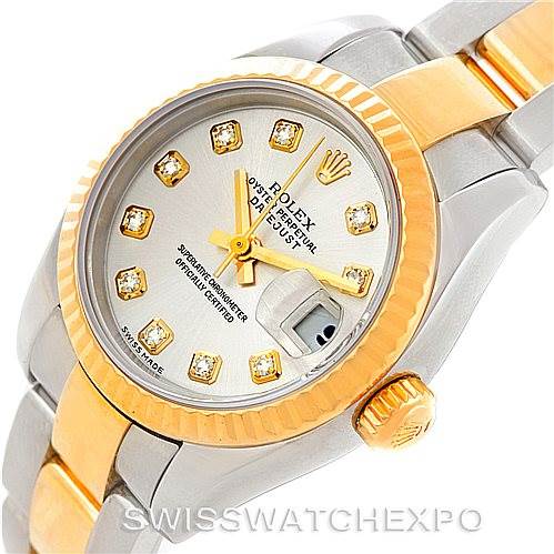 This image shows a close-up, three-quarter view of a Rolex Datejust 179173 Women's Steel and Gold (two tone) Silver Dial 179173 Women's Steel and Gold (two tone) Silver Dial watch, highlighting its dial, bezel, crown, and bracelet.