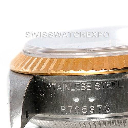 This image shows a close-up of a Rolex Datejust 79173 Women
s Stainless Steel White Dial 79173 Women
s Stainless Steel White Dial watch, highlighting its stainless steel casing and fluted bezel.