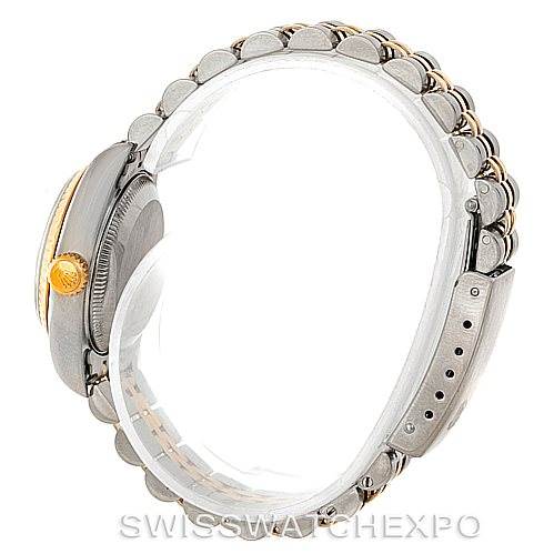 The image shows a side view of a Rolex Datejust 79173 Women
s Stainless Steel White Dial 79173 Women
s Stainless Steel White Dial watch highlighting its crown and two-tone bracelet.