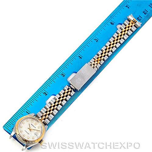 The image shows a Rolex Datejust 79173 Women's Stainless Steel Silver Dial 79173 Women's Stainless Steel Silver Dial watch laid flat next to a blue ruler, highlighting the face and entire length of the watchband.