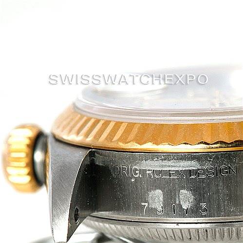 This image shows a close-up of the side view of a Rolex Datejust 79173 Women's Stainless Steel Silver Dial 79173 Women's Stainless Steel Silver Dial, highlighting the crown, case, and model number engraving.