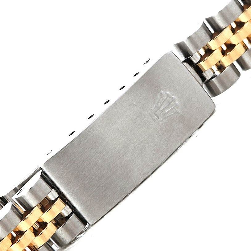 The image shows the clasp of a Rolex Datejust 69173 Women
s Stainless Steel Blue Dial 69173 Women
s Stainless Steel Blue Dial watch bracelet from a close-up angle.