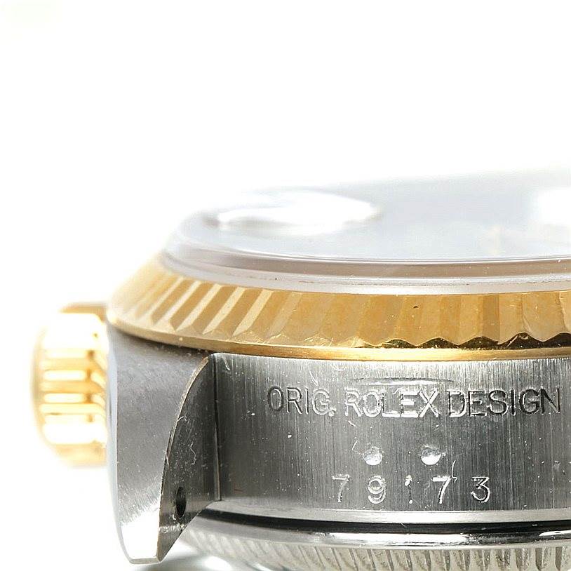 This is a close-up image showing the side of the Rolex Datejust 79173 Women's Stainless Steel Mother of Pearl Dial 79173 Women's Stainless Steel Mother of Pearl Dial watch, displaying the crown, bezel, and part of the case with the model number.