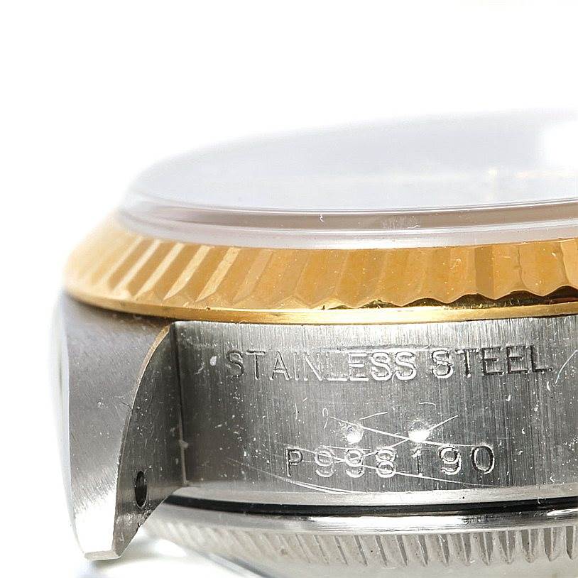 This close-up image shows a portion of the bezel, case, and engravings on a Rolex Datejust 79173 Women's Stainless Steel Mother of Pearl Dial 79173 Women's Stainless Steel Mother of Pearl Dial watch.