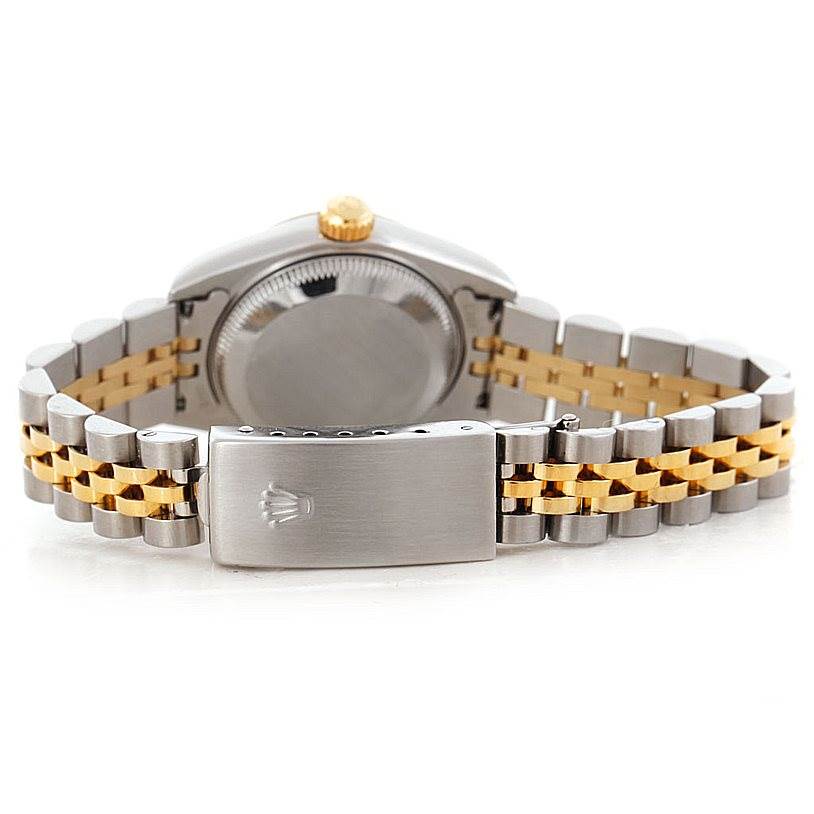 The image shows the rear view of a Rolex Datejust 79173 Women's Stainless Steel Mother of Pearl Dial 79173 Women's Stainless Steel Mother of Pearl Dial watch, focusing on the case back and two-tone jubilee bracelet with a clasp.