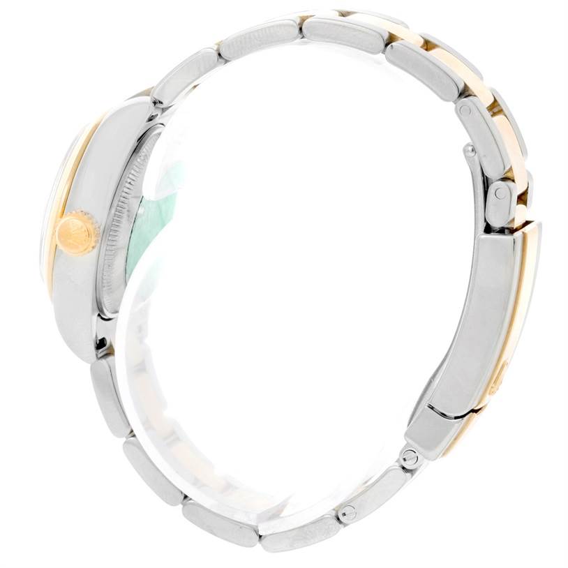 This image shows a side view of the Rolex Datejust 179163 Women's Steel and Gold (two tone) White Dial 179163 Women's Steel and Gold (two tone) White Dial watch, highlighting its crown and bracelet.