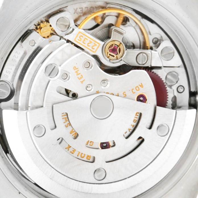 This image shows the intricate automatic movement mechanism of a Rolex Datejust 179163 Women's Steel and Gold (two tone) White Dial 179163 Women's Steel and Gold (two tone) White Dial watch, viewed from the back.