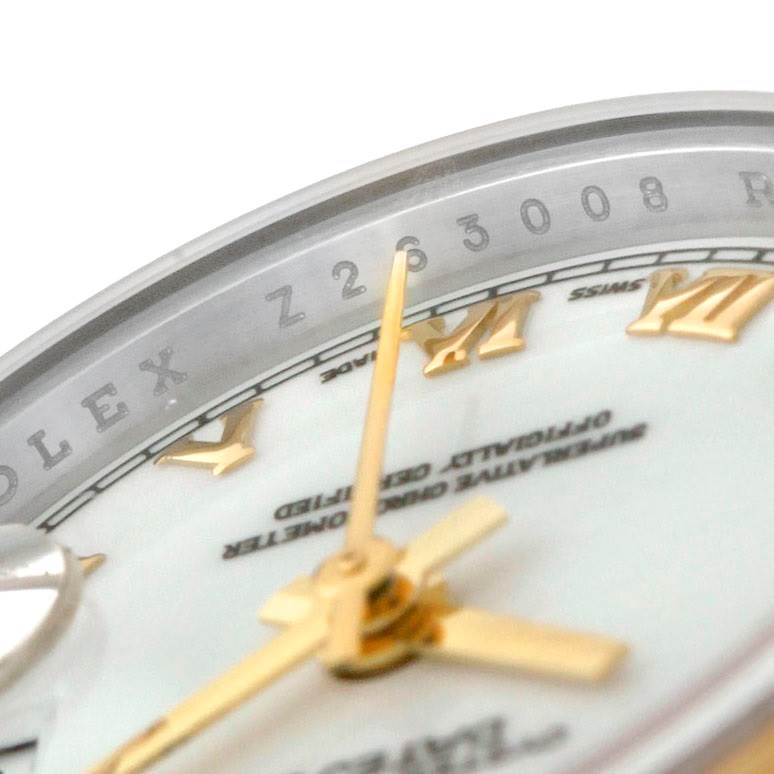 This close-up view shows the dial, Roman numeral markers, and part of the bezel of a Rolex Datejust 179163 Women's Steel and Gold (two tone) White Dial 179163 Women's Steel and Gold (two tone) White Dial watch.