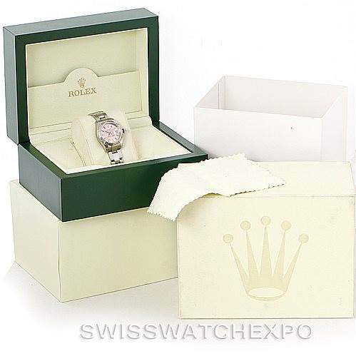 The image shows a Rolex Datejust 179174 Women's Stainless Steel Pink Dial 179174 Women's Stainless Steel Pink Dial watch at a front angle in its open box, with additional packaging and a cleaning cloth visible.