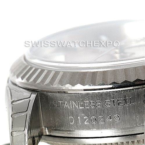 The image shows a close-up angle of the side of a Rolex Datejust 179174 Women's Stainless Steel Pink Dial 179174 Women's Stainless Steel Pink Dial watch, focusing on the stainless steel case and serial number.