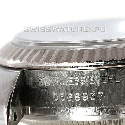 The image shows a close-up angle of the Rolex Datejust 179174 Women's Stainless Steel Mother of Pearl Dial 179174 Women's Stainless Steel Mother of Pearl Dial watch, focusing on the side of the case with the serial number and part of the bezel.