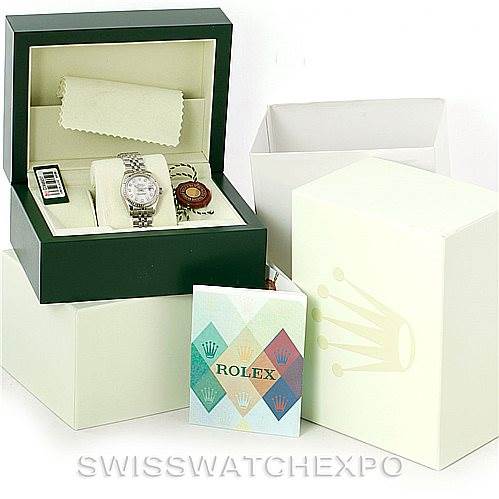 The image shows a Rolex Datejust 179174 Women's Stainless Steel Mother of Pearl Dial 179174 Women's Stainless Steel Mother of Pearl Dial model watch in its open box with additional packaging and accessories, including a manual and tags.