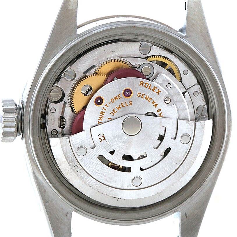 The image shows the back and internal mechanism of a Rolex Datejust 79174 Women's Stainless Steel Mother of Pearl Dial 79174 Women's Stainless Steel Mother of Pearl Dial watch, highlighting its gears and movement components.